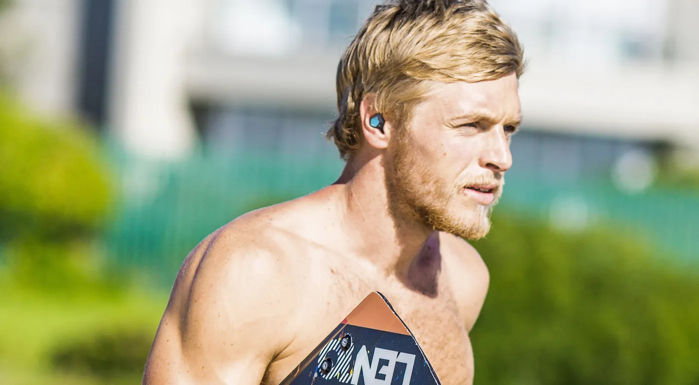 An athlete wearing KANOA earphones