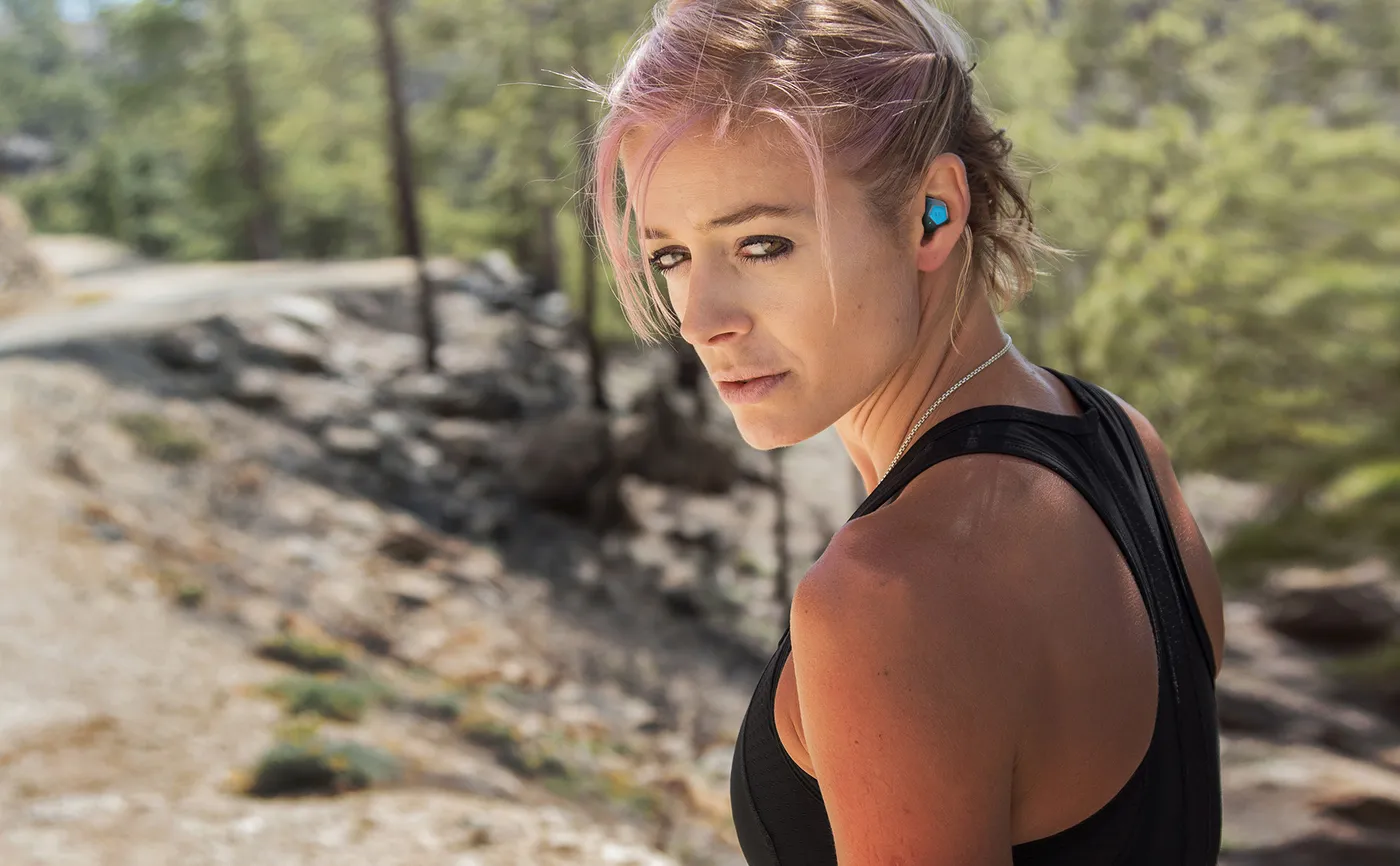 An athlete on a trail wearing KANOA